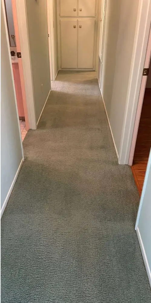 Heavy soil and dark traffic lanes on hallway carpet prior to deep steam extraction by Best Services in Atlanta GA.